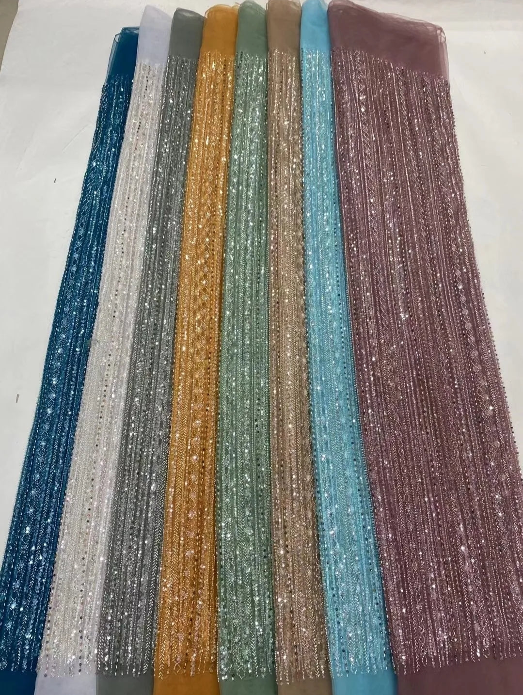 Beaded net lace fabrics