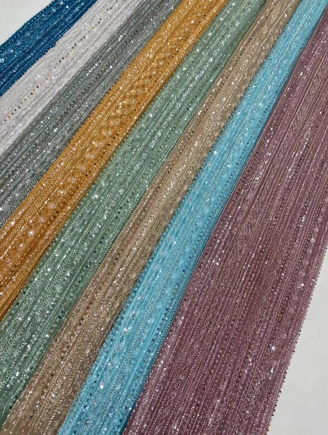 Beaded net lace fabrics